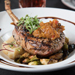 Grilled Bone-In Pork Chop -Beautifully grilled chop topped with apricot chutney, accompanied by crispy brussels sprouts and mashed potatoes, balsamic drizzle finish